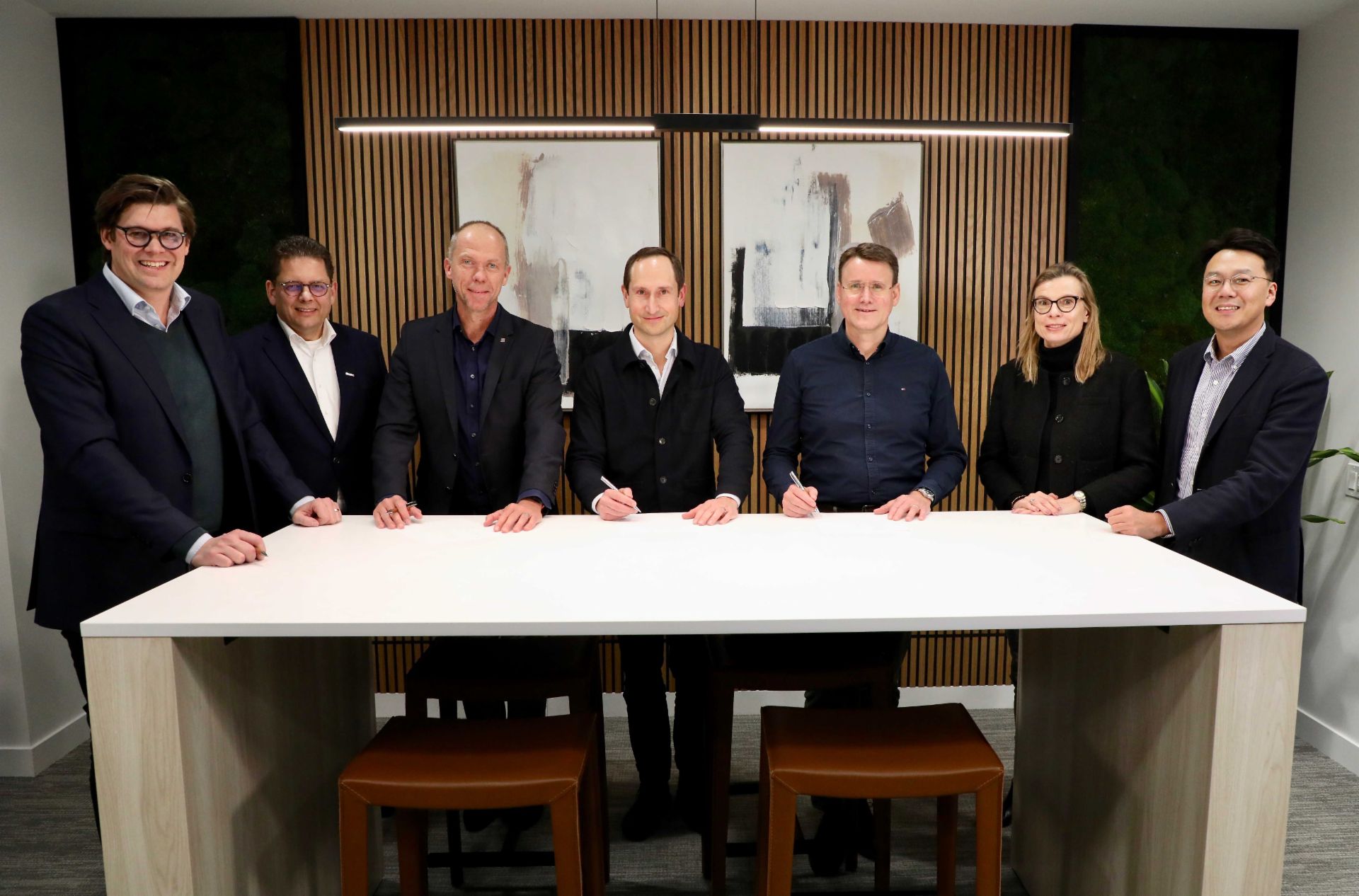 Plus-partnership-people-at-table Plus-partnership-people-at-table