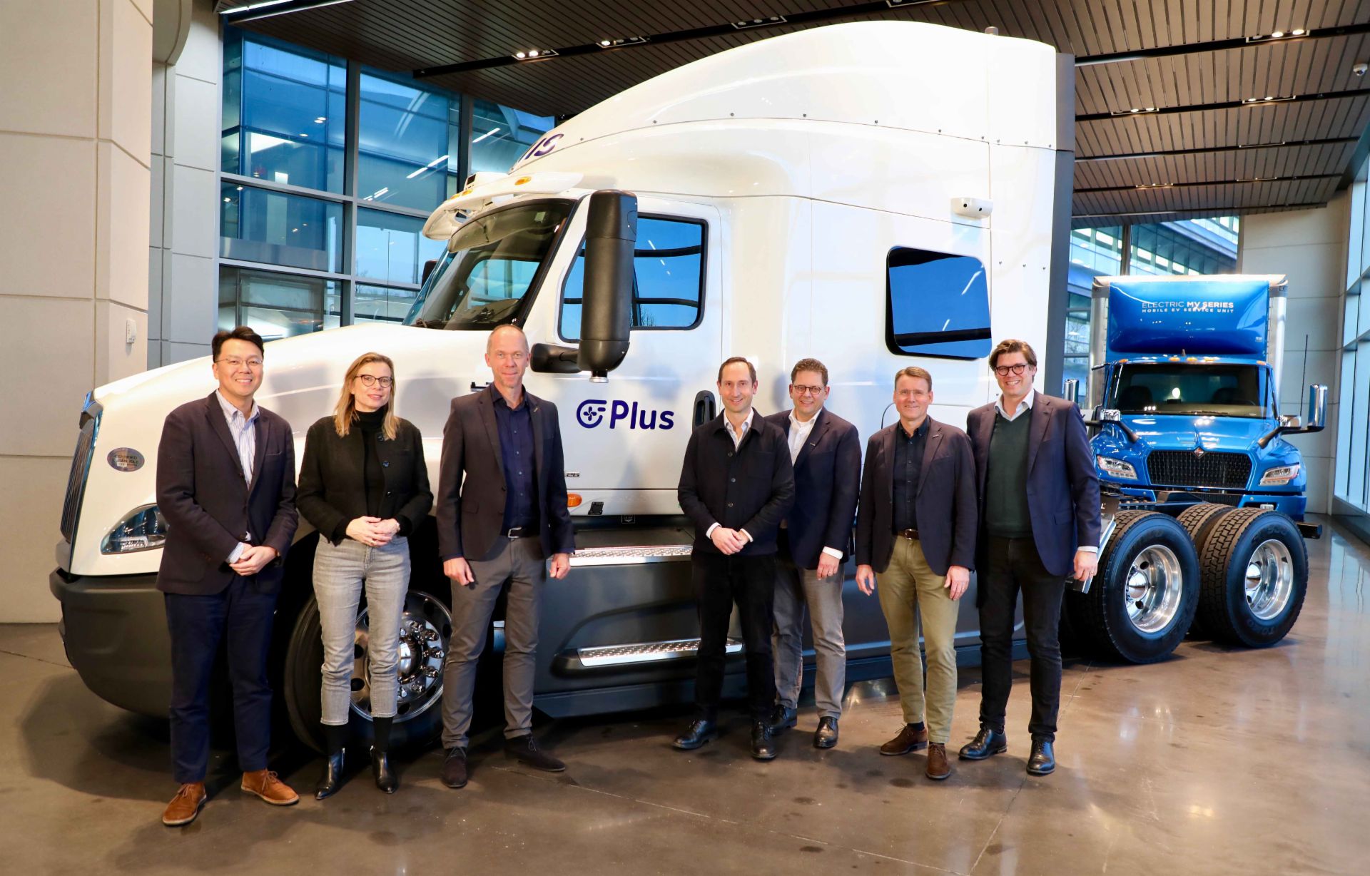 Plus-partnership-People-infront-of-truck Plus-partnership-People-infront-of-truck