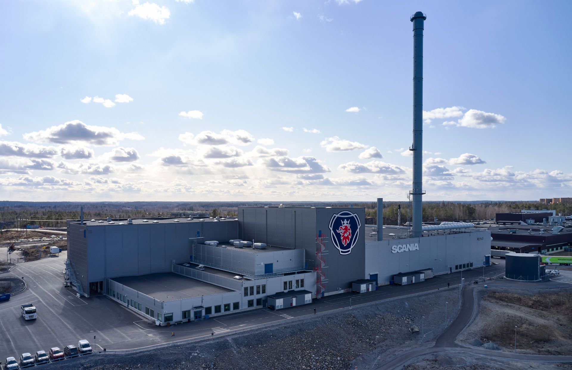 Scania foundry, with the company's logo prominently displayed on the building.