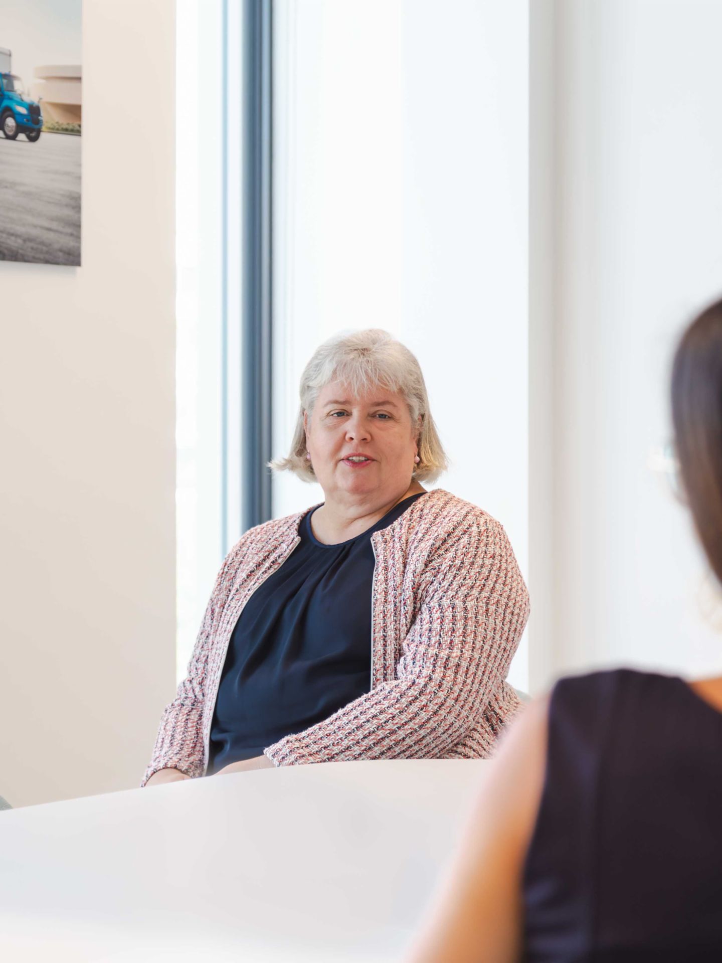 Frédérique Klein talks to a colleague