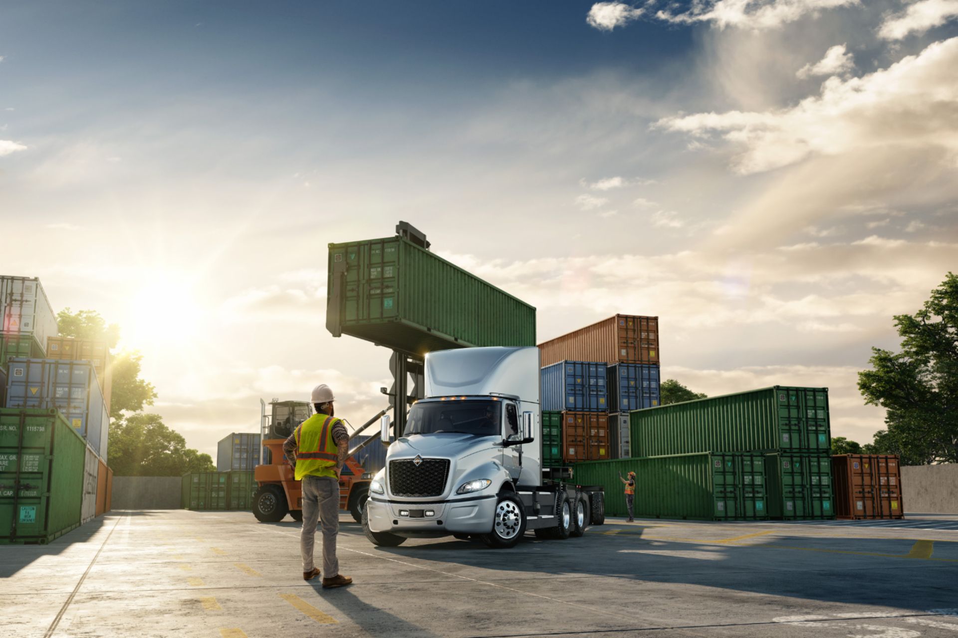 International freight yard rendering Worker supervises the loading and unloading of containers at an International freight yard