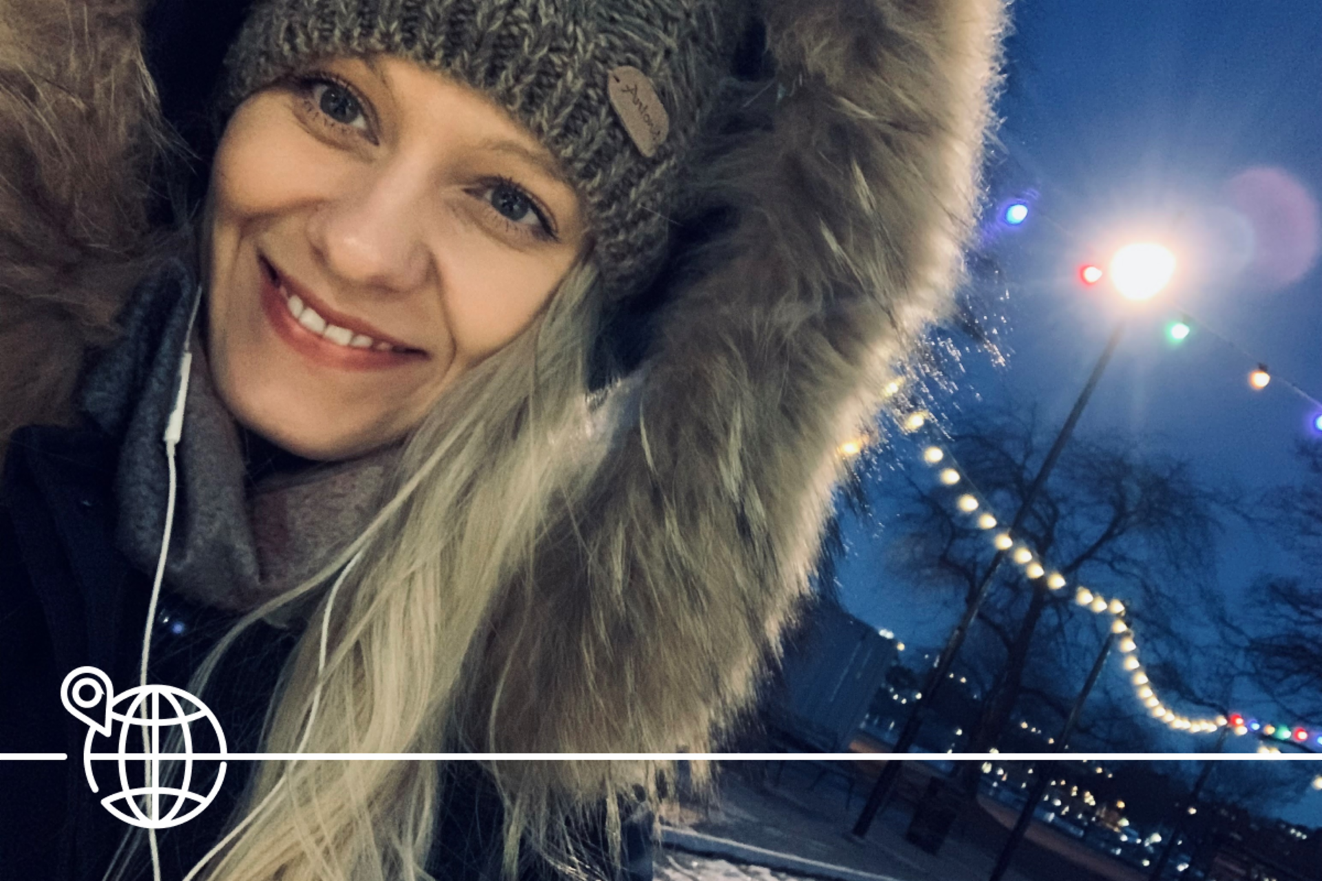 Woman in front of city lights of Soedertaelje